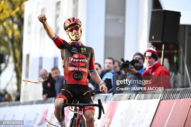 Belgian Eli Iserbyt celebrates as he crosses the finish line to win the men's elite race at the World Cup cyclocross cycling event in Troyes, France,...