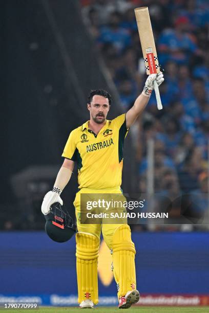 Australia's Travis Head celebrates after scoring a century during the 2023 ICC Men's Cricket World Cup one-day international final match between...