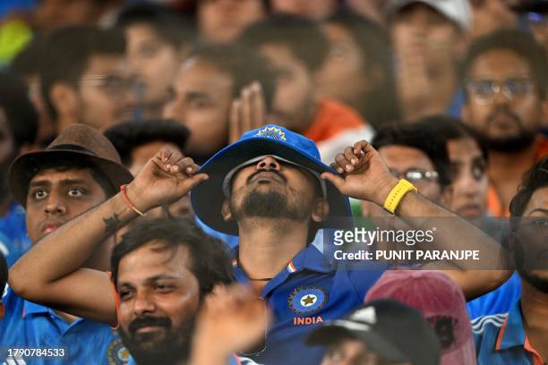 India fans react while watching the 2023 ICC Men's Cricket World Cup one-day international final match between India and Australia at the Narendra...
