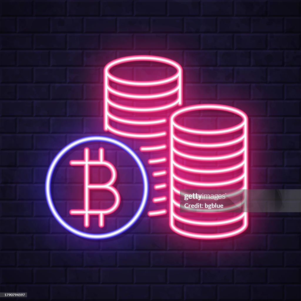 Bitcoin coins stacks. Glowing neon icon on brick wall background