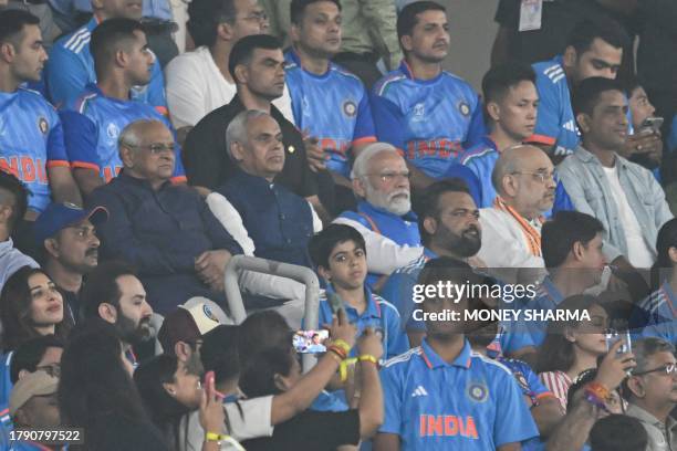 Indian Prime Minister Narendra Modi , with India's Home Minister Amit Shah and Gujarat's cheif minister Bhupendrabhai Patel watch the 2023 ICC Men's...