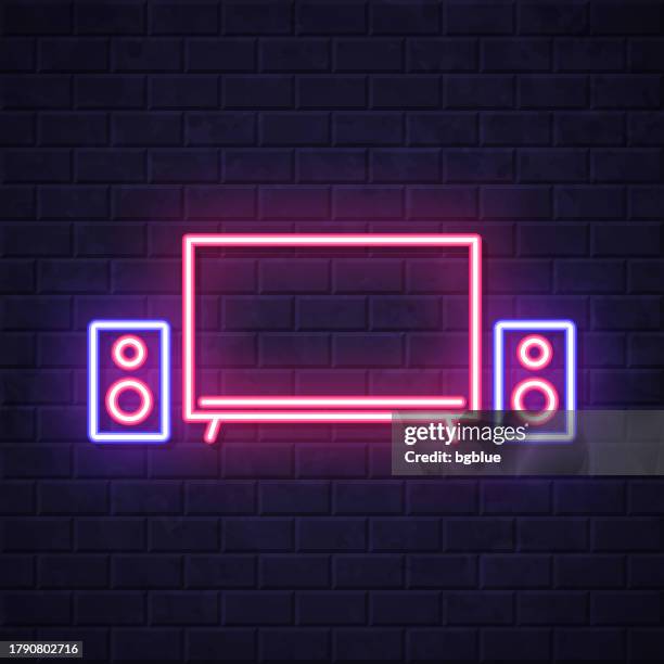 home cinema. glowing neon icon on brick wall background - projection wall studio stock illustrations