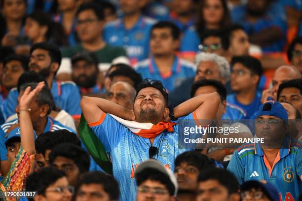 India fans react while watching the 2023 ICC Men's Cricket World Cup one-day international final match between India and Australia at the Narendra...