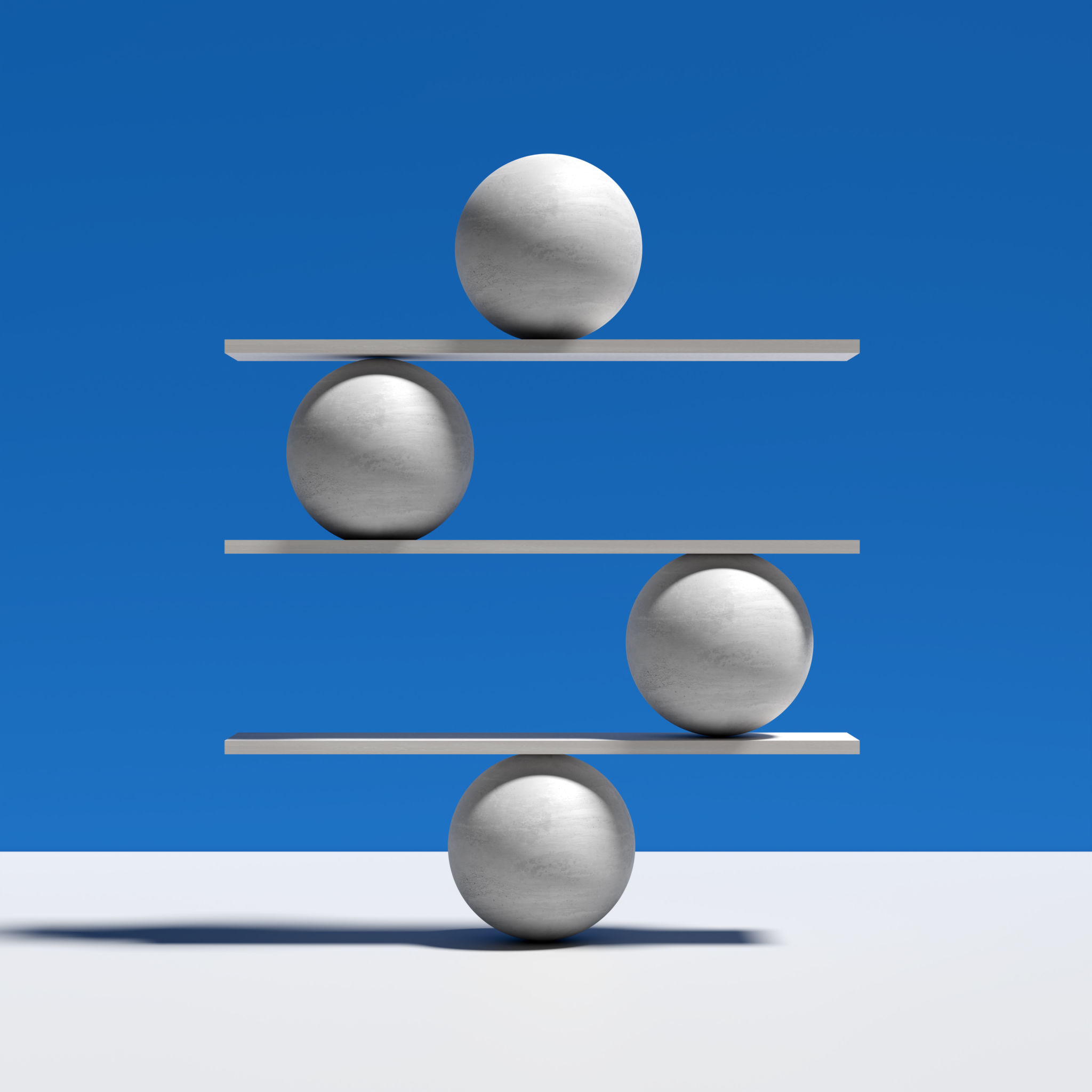 Harmony, balance, equilibrium and stability concepts. Spheres balancing on a seesaw. Harmony, balance, equilibrium and stability concepts. Spheres balancing on a seesaw.