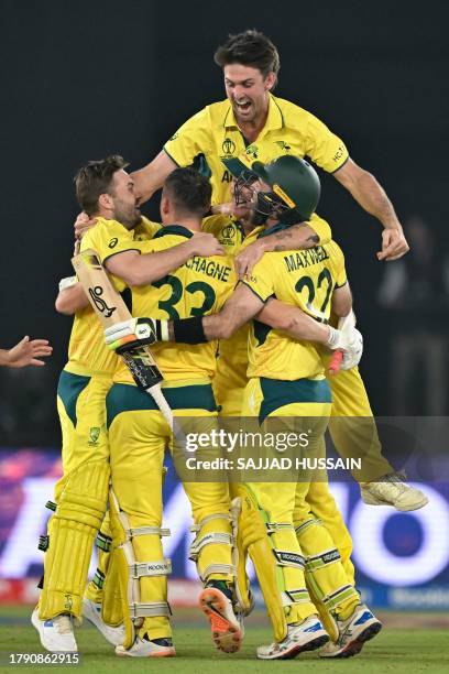 Australia's players celebrate after winning the 2023 ICC Men's Cricket World Cup one-day international final match between India and Australia at the...