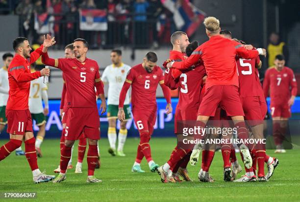 Serbia's players celebrate after they qualified for the Euro 2024 at the end of the UEFA Champions League Qualifying Group G football match between...