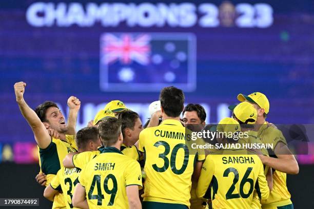 Australia's players celebrate after winning the 2023 ICC Men's Cricket World Cup one-day international final match between India and Australia at the...