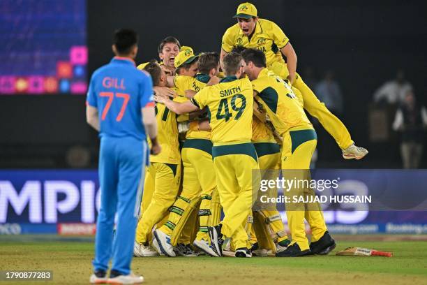Australia's players celebrate after winning the 2023 ICC Men's Cricket World Cup one-day international final match between India and Australia at the...