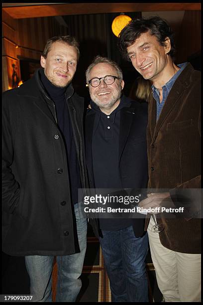 Dominique Segall in between the brothers Nicolas and Eric Altmayer at The 60th Birthday Celebration Of Dominique Segall At Mathys Restaurant In Paris.