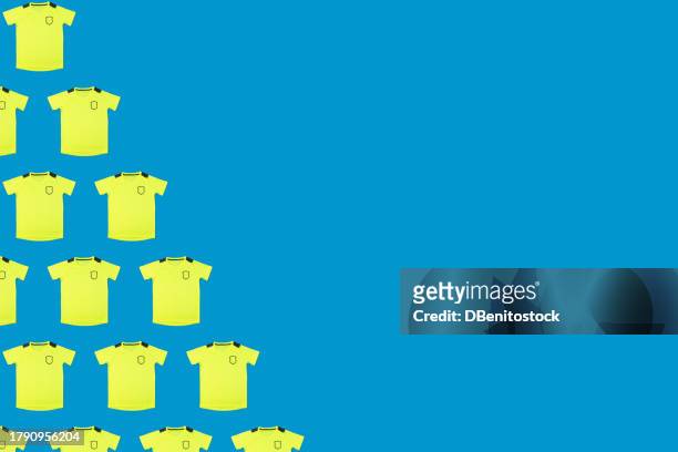 yellow soccer team jerseys pattern,on the left side, on blue background. concept of sport, soccer ball, uniform, world cup and team. - sports jersey stock-fotos und bilder