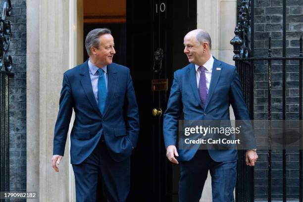 Britain's former Prime Minister, David Cameron , leaves 10, Downing Street with Sir Philip Barton, the Permanent Under-Secretary of the Foreign,...