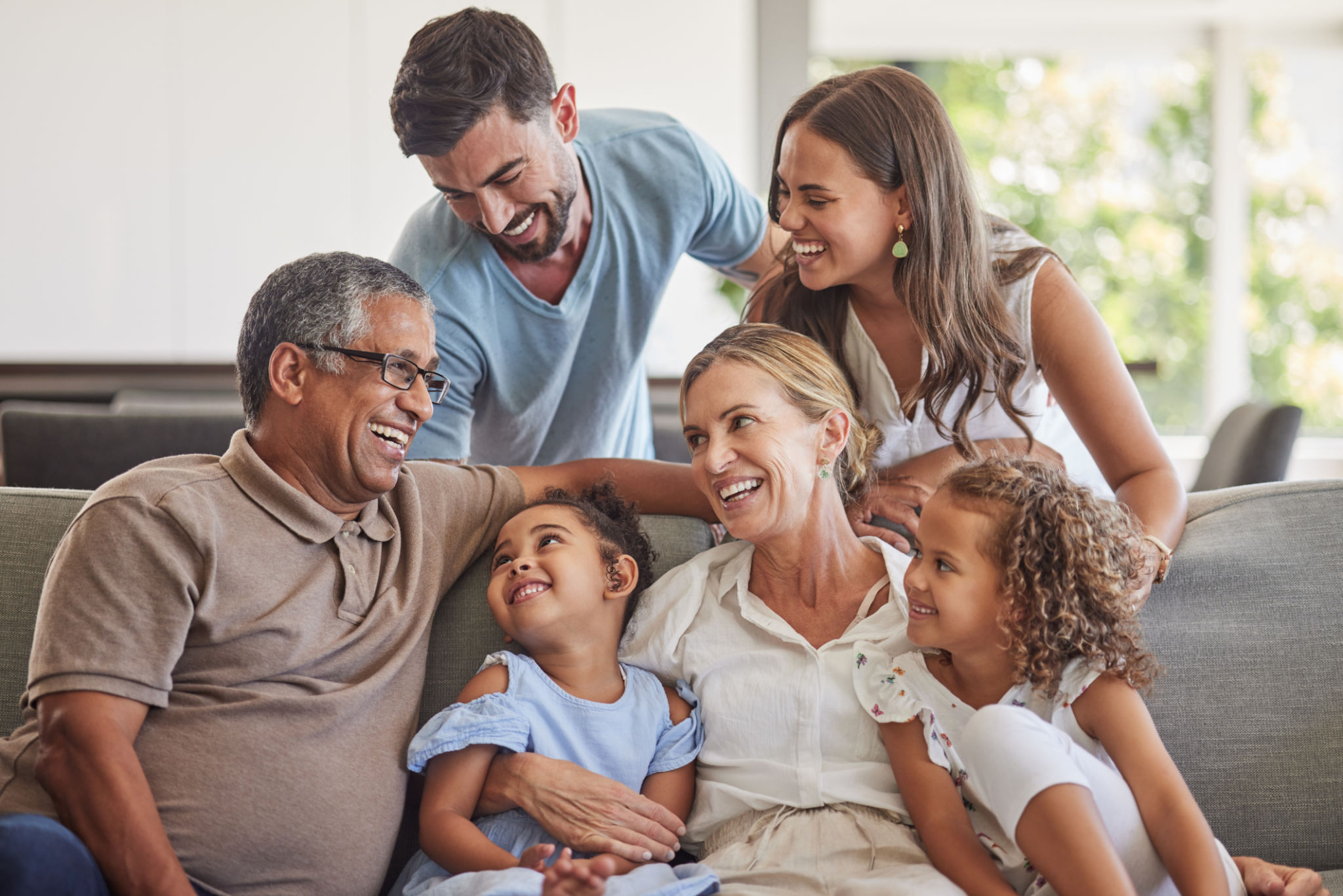 Relax, love and big family happy on sofa smile together in home on the weekend with children. Cheerful and diverse senior grandparents, parents and young kids in Brazil bond in living room. Relax, love and big family happy on sofa smile together in home on the weekend with children. Cheerful and diverse senior grandparents, parents and young kids in Brazil bond in living room.