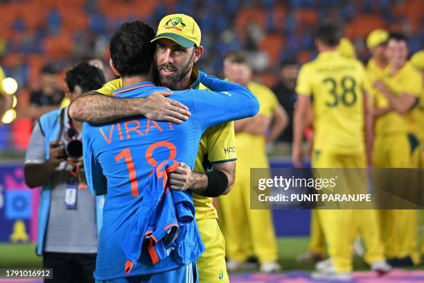 Australia's Glenn Maxwell embraces India's Virat Kohli at the end of the 2023 ICC Men's Cricket World Cup one-day international final match between...