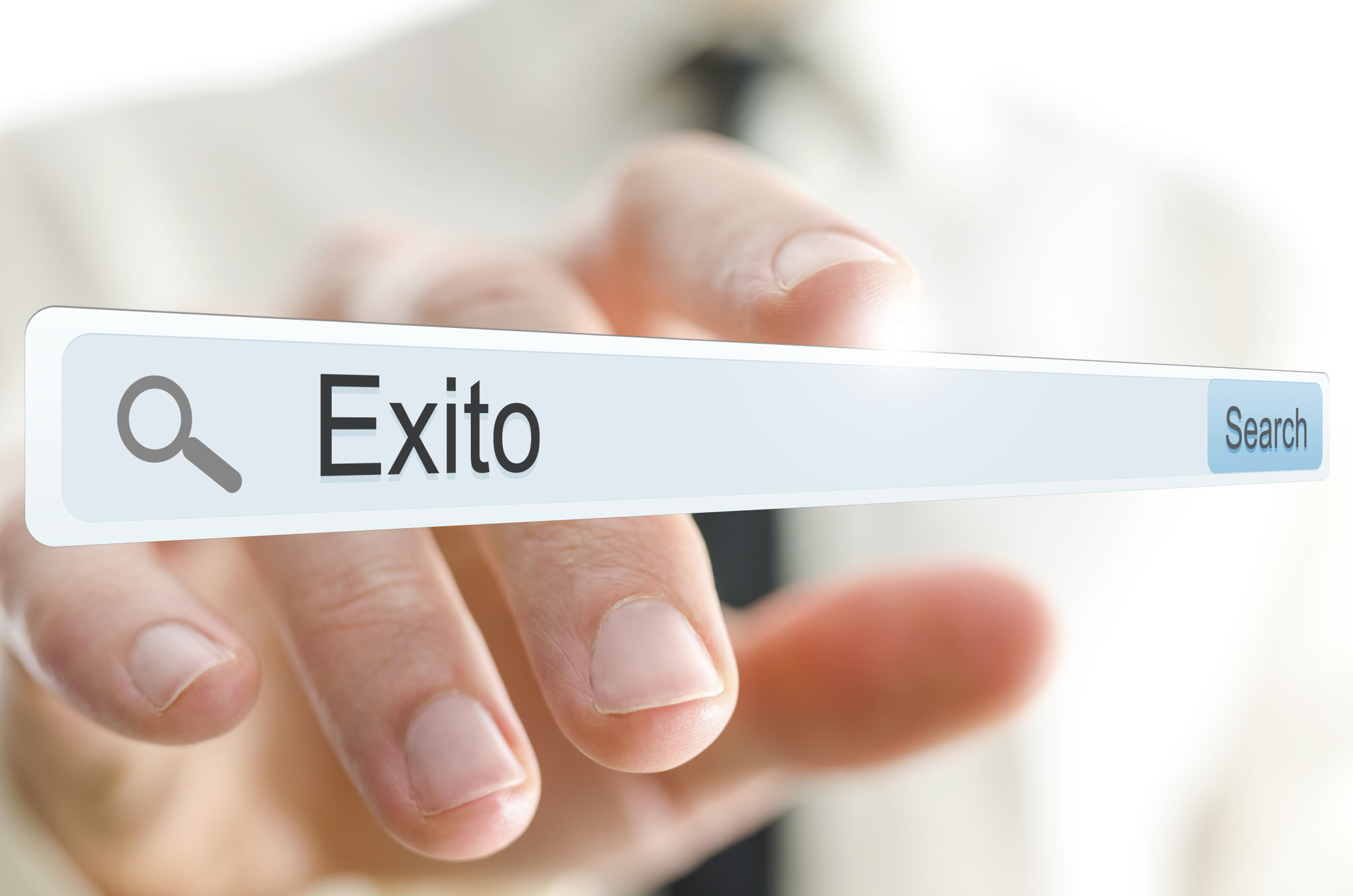 Word Exito written in search bar. Spanish for success. Word Exito written in search bar. Spanish for success.
