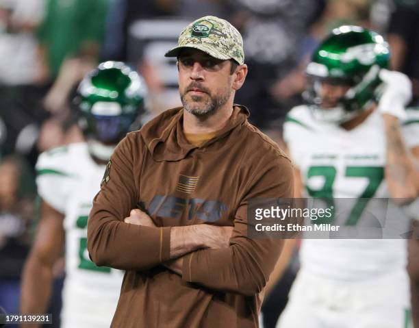 Quarterback Aaron Rodgers of the New York Jets stands on the field during warmups before a game against the Las Vegas Raiders at Allegiant Stadium on...