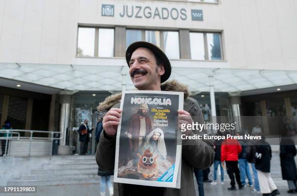 The editor of the satirical magazine Mongolia, Dario Adanti, poses with the cover of the magazine on the day they committed the alleged crime, at the...
