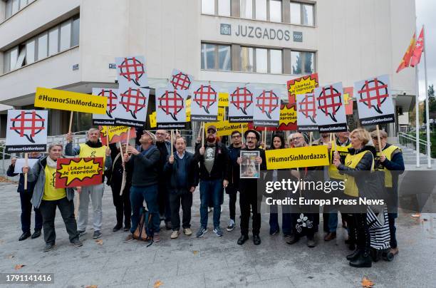 The editor of the satirical magazine Mongolia, Dario Adanti , poses with the magazine's cover from the day they committed the alleged crime and...