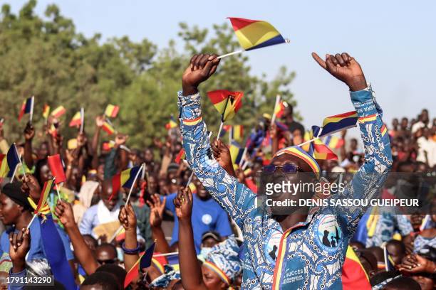 Supporters of the Chadian opposition party Les Transformateurs react as opposition leader Succes Masra addresses them for the first time since his...