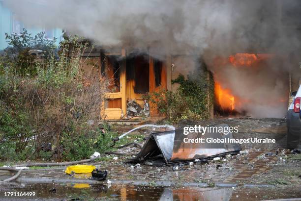 Firefighters extinguish a fire after Russian artillery shelling of city centre on November 11, 2023 in Kherson, Ukraine. On the day of the first...