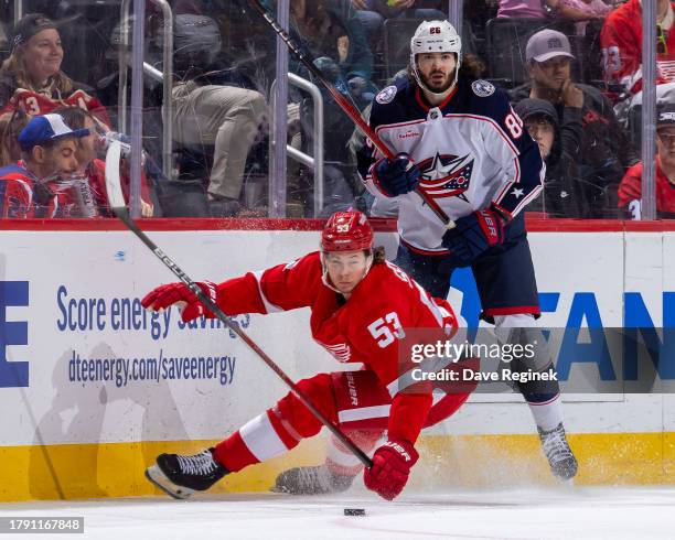 Moritz Seider of the Detroit Red Wings attempts to block a pass from Kirill Marchenko of the Columbus Blue Jackets during the third period at Little...