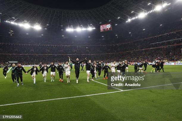 Hungary's players including forward Dominik Szoboszlai celebrate with their fans after winning the UEFA Euro 2024 group G qualification football...