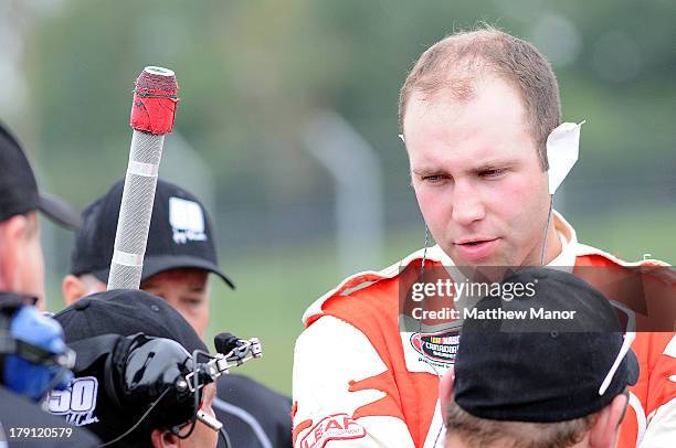 Joey McColm, driver of the TSC Stores/Canada's Best Stores Fixtures Dodge talks with his crew during the practice session at the NASCAR Canadian Tire...