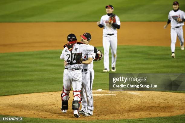 Pitcher Go Woo-suk of LG Twins celebrates with Catcher Park Dong-won after winning the Korean Series Game Five between LG Twins and KT Wiz at Jamsil...