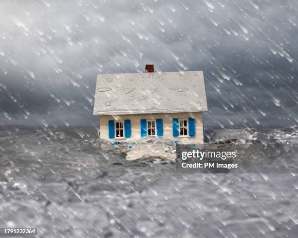 house in flood - natural disaster house stock pictures, royalty-free photos & images
