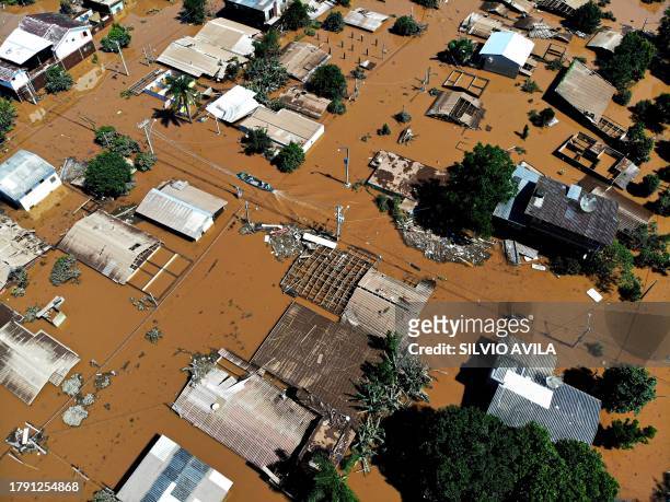 Aerial view of a flooded neighborhood in Encantado, Rio Grande do Sul state, Brazil on November 19, 2023. Heavy rains battering southern Brazil since...