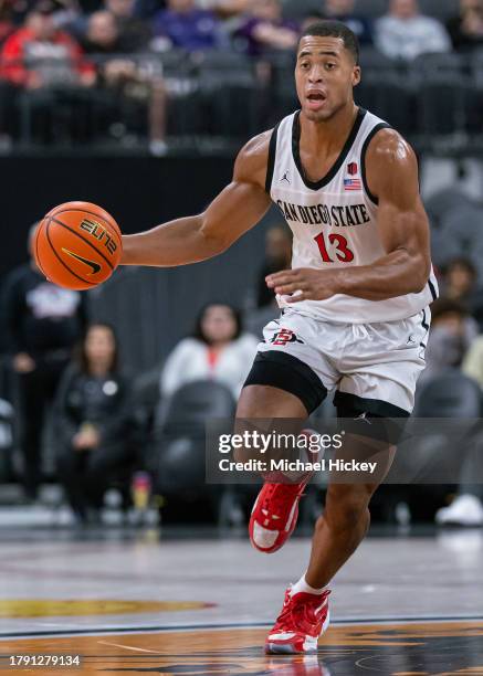 Jaedon LeDee of the San Diego State Aztecs brings the ball up court during the game against the St. Mary's Gaels in the Continental Tire Main Event...
