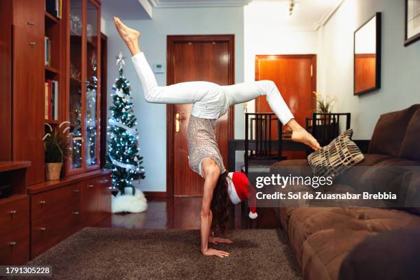 woman doing a handstand - flexibility stock pictures, royalty-free photos & images