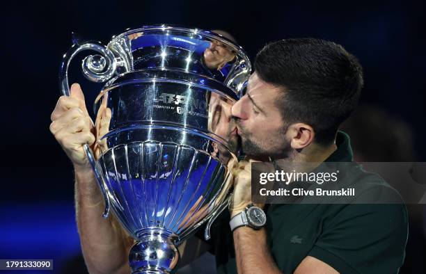 Novak Djokovic of Serbia kisses the ATP Year End World Number One Trophy on day two of the Nitto ATP Finals at Pala Alpitour on November 13, 2023 in...