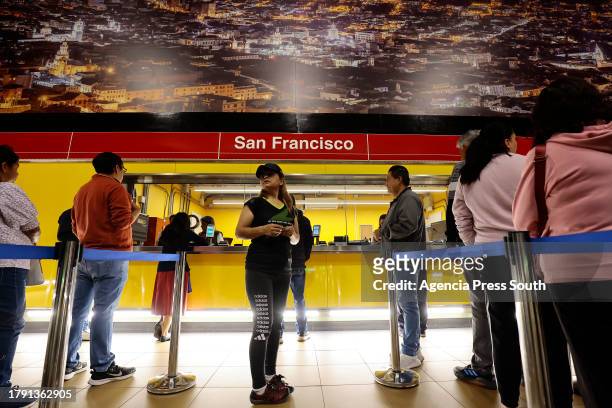 Users buy a card to travel on the newly Ecuadors' Metro during test day prior it's inaguration on November 19, 2023 in Quito, Ecuador.