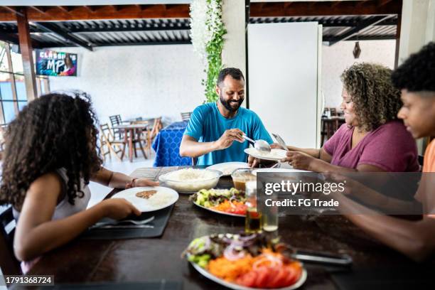 family having lunch in hotel restaurant - comfort food stock pictures, royalty-free photos & images