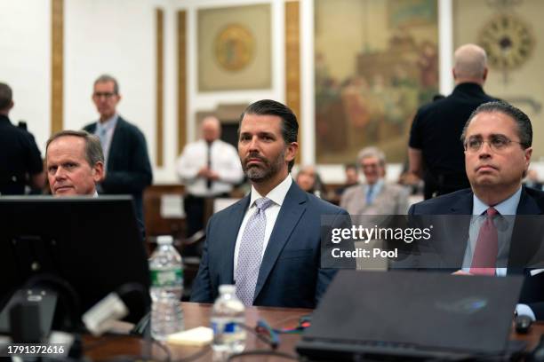 Attorney Christopher Kise, Donald Trump Jr., and Attorney Cliff Robert sit in the courtroom for Trump's civil fraud trial at New York State Supreme...