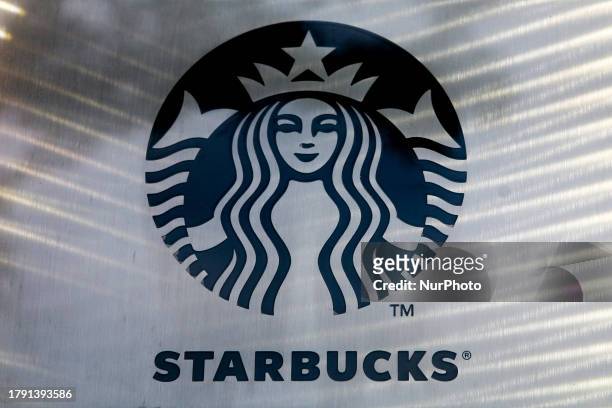 Starbucks coffee shop logo seen on the Main Square on November 12, 2023 in Krakow, Poland.