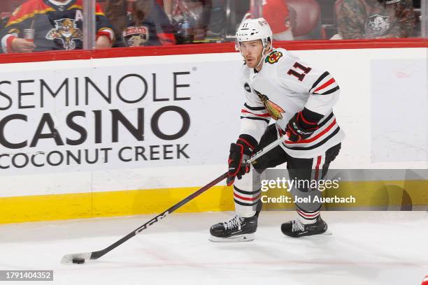 Taylor Raddysh of the Chicago Blackhawks skates with the puck during third period action against the Florida Panthers at the Amerant Bank Arena on...