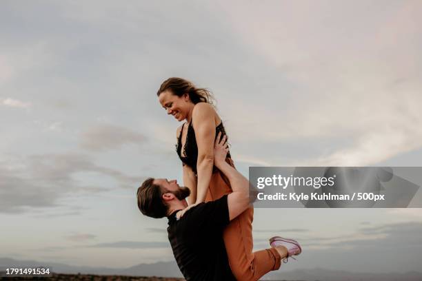 portrait of happy couple dancing at sunset,las vegas,nevada,united states,usa - acroyoga stock pictures, royalty-free photos & images