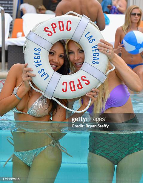 Sister-in-law's model Caya Hefner and television personality/model/DJ Crystal Hefner appear at the Sapphire Pool & Dayclub as Crystal hosts Labor Day...