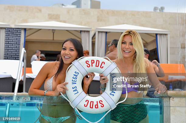 Sister-in-law's model Caya Hefner and television personality/model/DJ Crystal Hefner appear at the Sapphire Pool & Dayclub as Crystal hosts Labor Day...