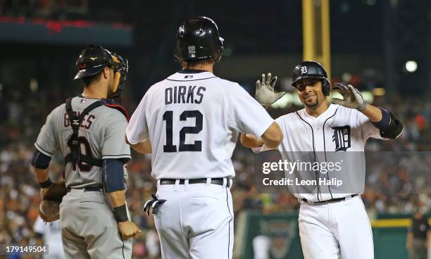 Omar Infante of the Detroit Tigers hits a two run home run scoring Andy Dirks in the sixth inning of the game against the Cleveland Indians at...
