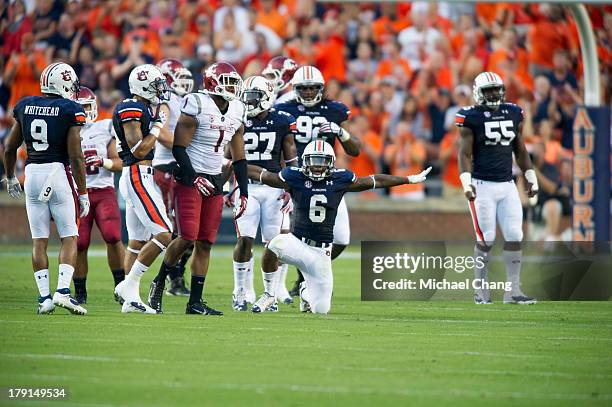 Defensive back Jonathon Mincy of the Auburn Tigers celebrates after tackling a Washington State Cougars player during the first half of play on...