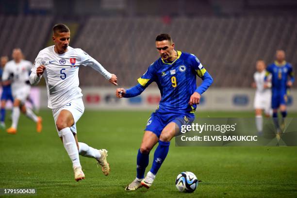 Bosnia and Herzegovina's Smail Prevljak fights for the ball with Slovakia's Lubomir Satka during the UEFA Euro 2024 Group J qualification football...