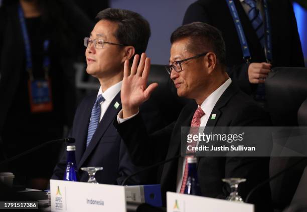 People's Republic of China Minister of Finance Lan Fo'an and Paul Chan Mo-po, Financial Secretary of Hong Kong, look on before the start of the...