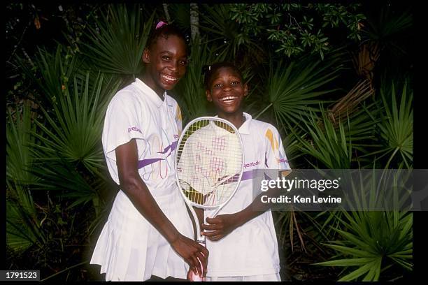 Venus Williams stands with her sister and fellow tennis player Serena Williams.