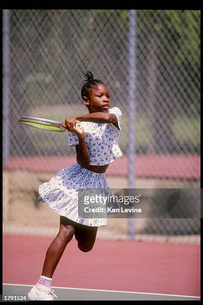 Serena Williams in action on the tennis court.