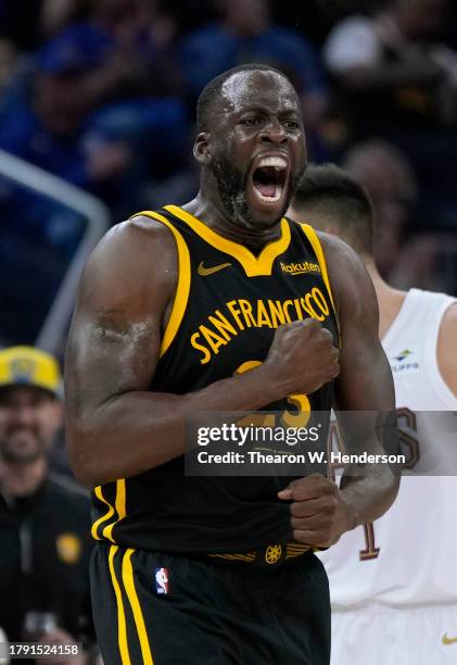 Draymond Green of the Golden State Warriors reacts after stealing the ball from Donovan Mitchell of the Cleveland Cavaliers during the second half of...