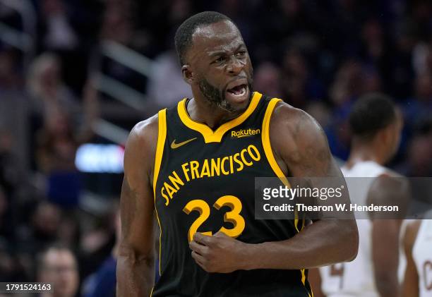 Draymond Green of the Golden State Warriors reacts after stealing the ball from Donovan Mitchell of the Cleveland Cavaliers during the second half of...
