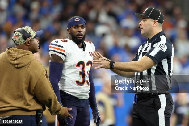 Chicago Bears cornerback Jaylon Johnson discusses a call with down judge Brian Sakowski during an NFL football game between the Detroit Lions and the...