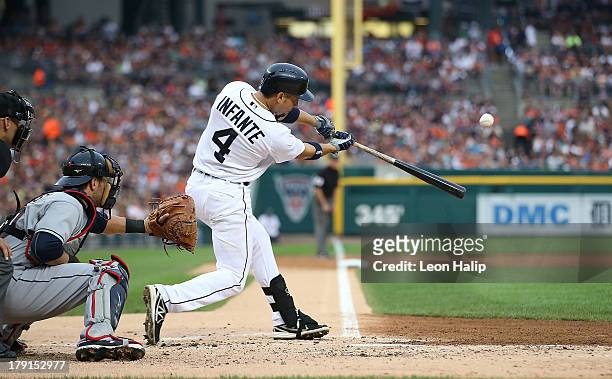 Omar Infante of the Detroit Tigers hits a three run home run in the second inning scoring Victor Martinez and Matt Tuiasosopo during the game against...